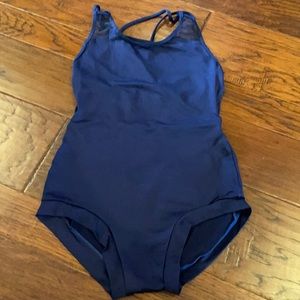 Used MotionWear Navy Blue leotard with mesh back. Banded leg size Med Adult